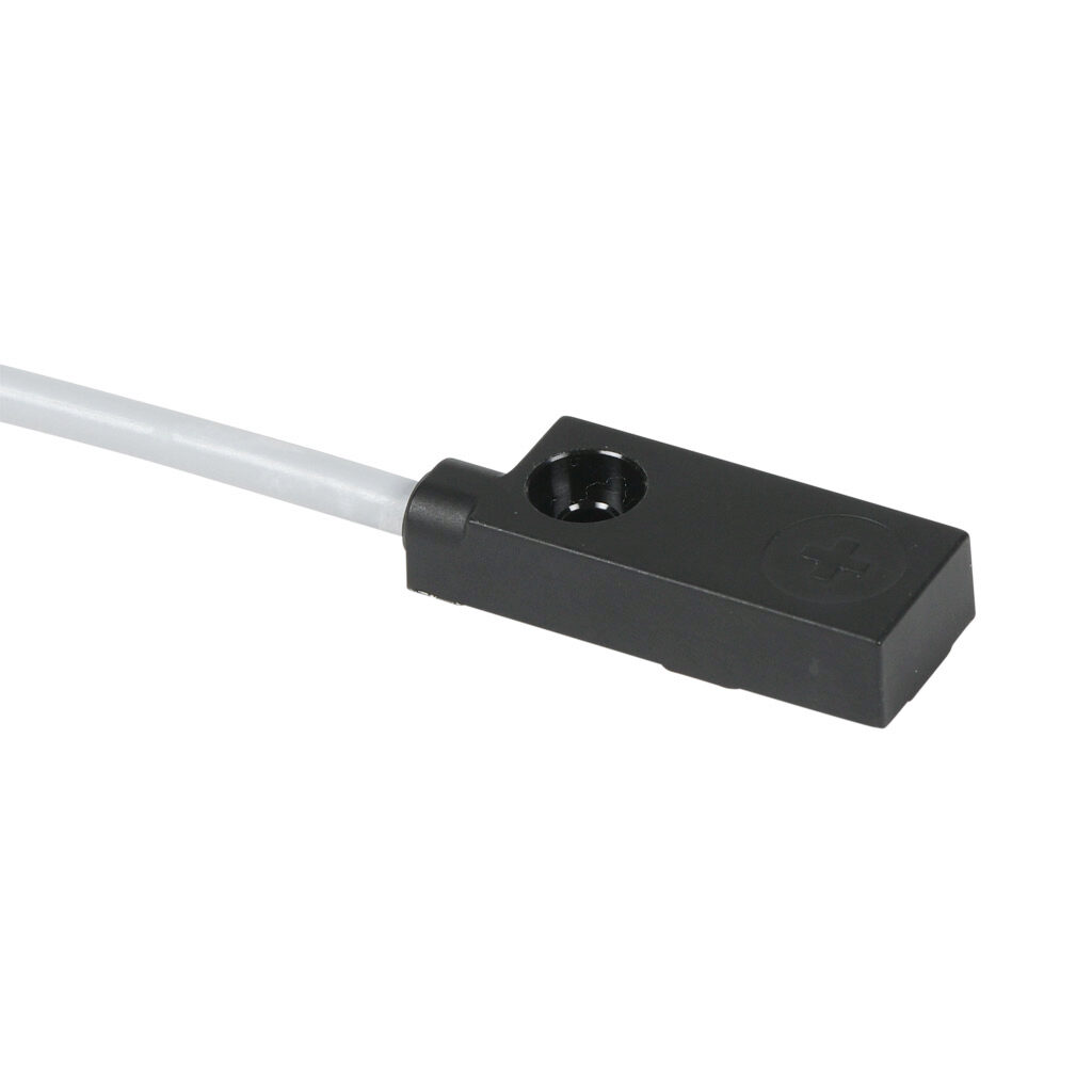 DW-AD-612-C12P - Contrinex inductive proximity sensor, rectangular, 12 x 27 x 6.5mm body, polycarbonate housing, top sensing, NPN, N.C. output, 4mm sensing distance, non-flush, 2000 Hz switching frequency, IP67, pigtail.